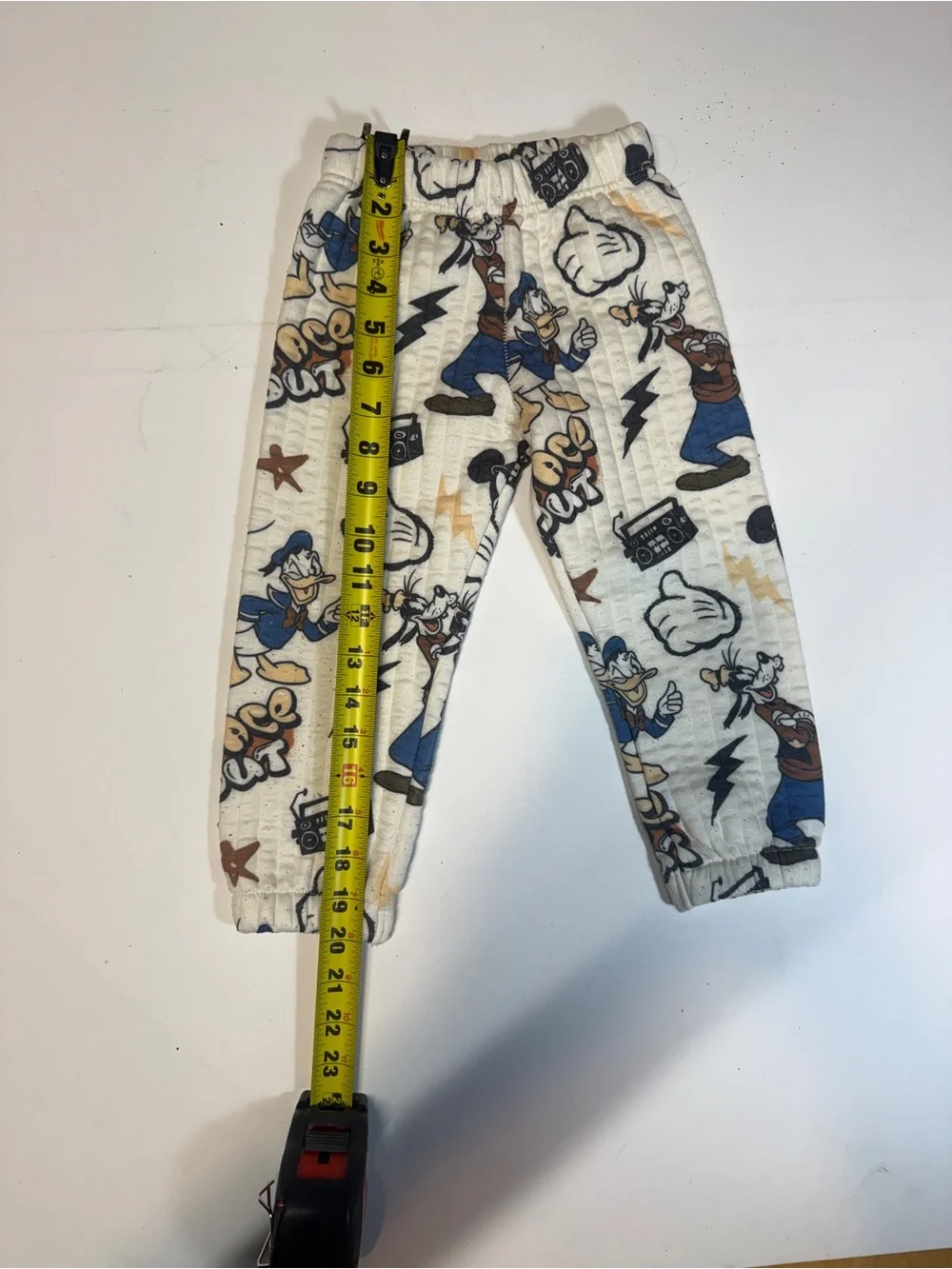 White Cartoon Character Jogger Pants with Blue & Tan Accents